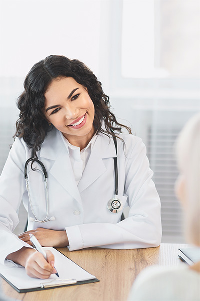 an admissions counselor talking to a resident